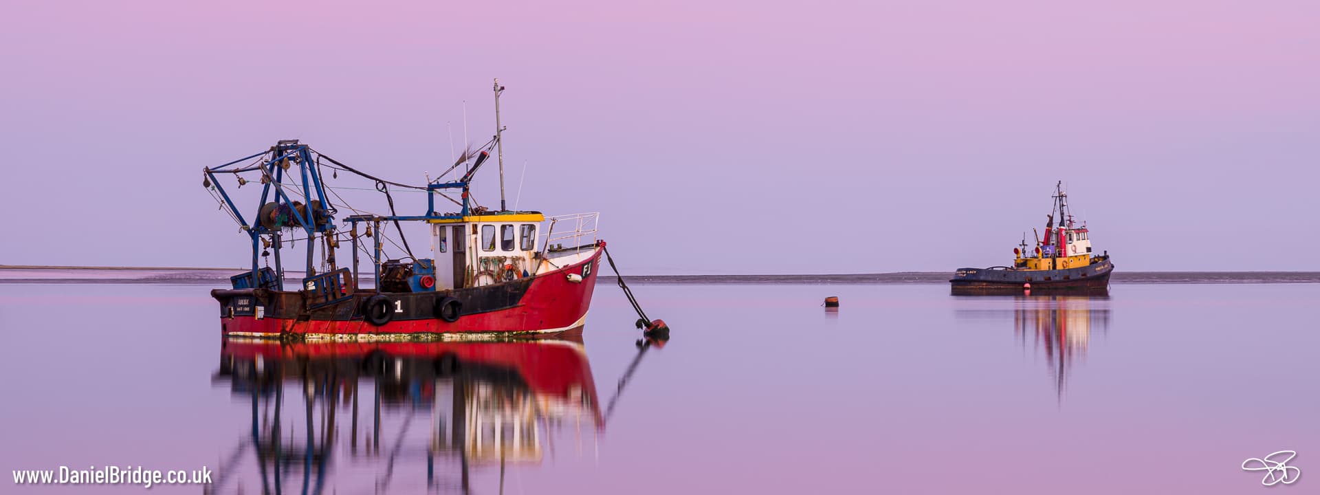 Fishing Boats on still water at dusk
