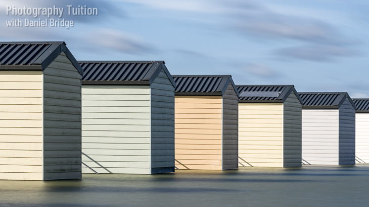 Long exposure shot of the beach huts near Osea Island, Essex