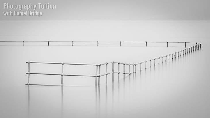 Railings at high tide, Brightlingsea Beach, Essex.